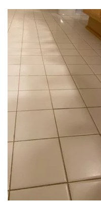 Floor tile grout before cleaning
